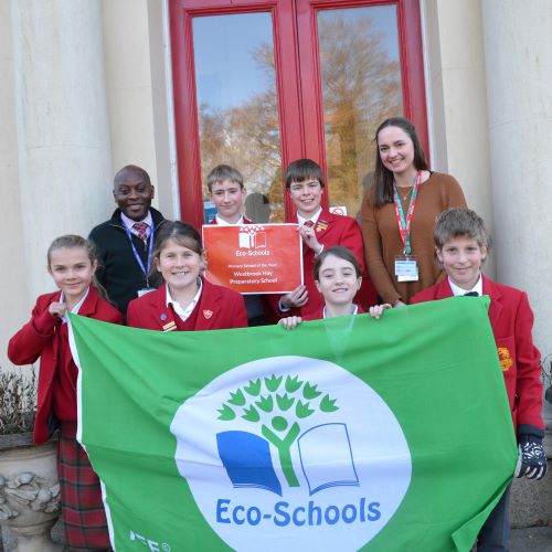 Eco Warriors from Westbrook Hay School hold up their Green Flag