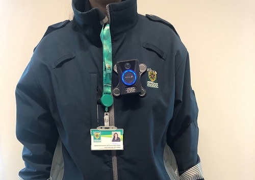 District Enforcement uniform front view with identification badge