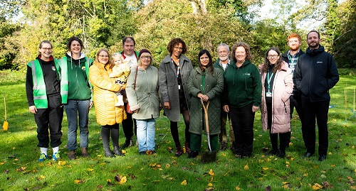 Councillor Simy Dhyani (holding spade) is joined by members of our Housing Service and representatives from Sunnyside Rural Trust at the site of the new community garden