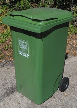 A green wheeled bin showing the Dacorum Borough Council logo